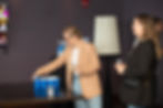 Professional attendees playing ping pong while holding drinks during the In-House Connect networking mixer at Vu Rooftop in Chicago’s South Loop neighborhood, with guests socializing and participating in games throughout the venue.