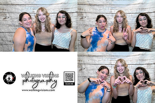 Guests enjoying a photo booth rental at an Illinois State University Multicultural Center event, creating fun group photos with Walking Visions Photography.