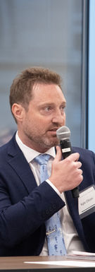Business professionals speaking during a corporate panel discussion event in Chicago.Business professionals speaking during a corporate panel discussion event in Chicago.