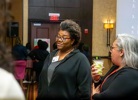 Conference attendees networking and having a discussion during an educational event at a downtown Chicago Marriott photographed by Walking Visions Photography.