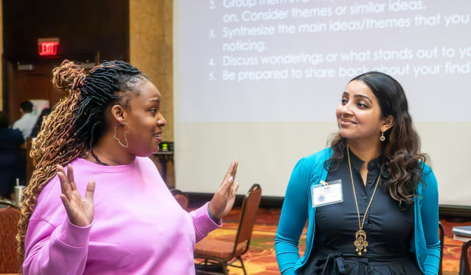Conference speaker presenting during an educational session at a downtown Chicago Marriott conference event photographed by Walking Visions Photography.