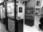 Black and white photo of a small clothing shop