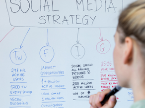 A woman planning her social media strategy on a white board