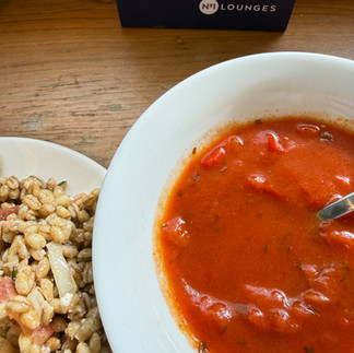 Fresh food selection at No 1 Lounge Heathrow T3 — tomato soup, salads, pastries, and light pre-flight meals.