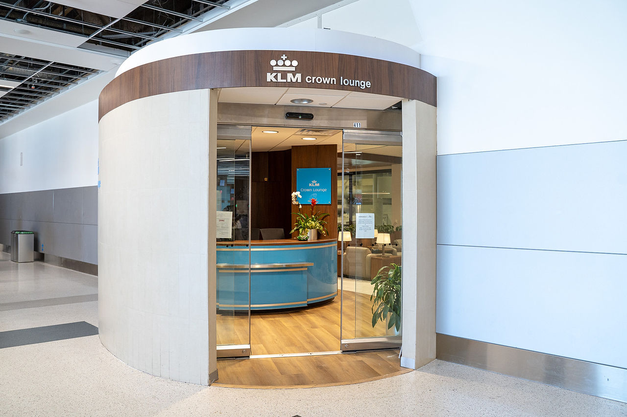 KLM Crown Lounge Amsterdam interior with gin bar and seating area spanning two floors"