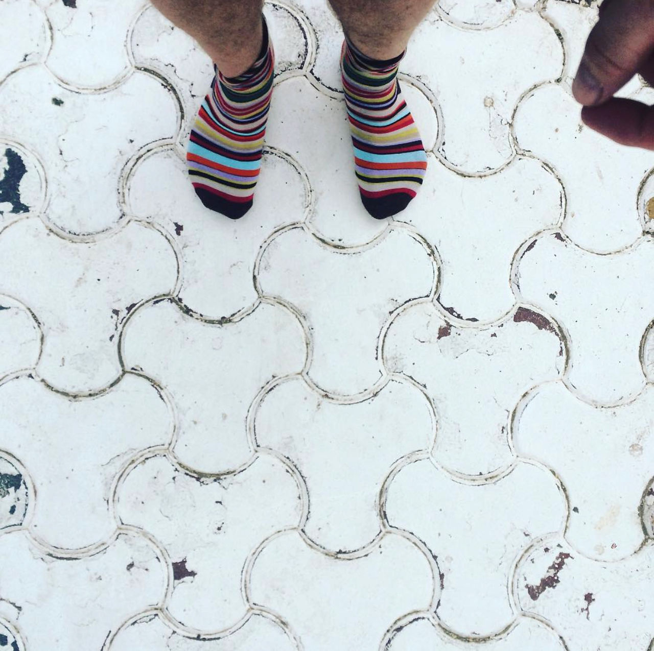 Plane Luxury Escapes India – travel blogger enjoying temple of rats in Paul Smith Socks!