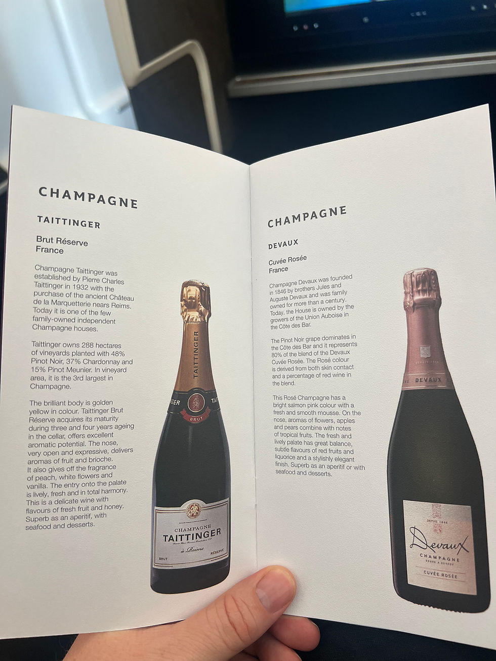 Qatar Airways business class wine list featuring premium international wines
