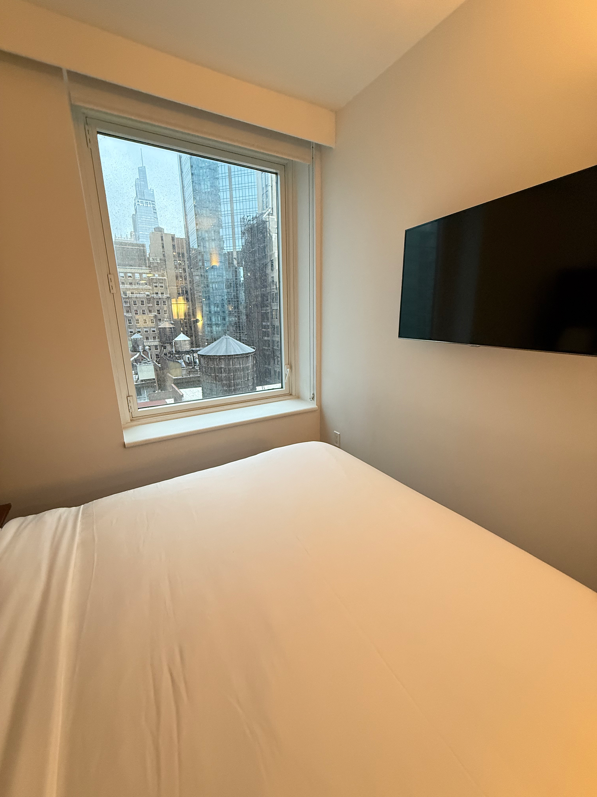 Compact Queen City View Room with windows and views of manhattan