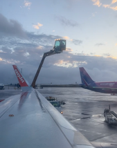 easyJet aircraft being de-iced at Keflavik Airport Iceland before departure in winter conditions