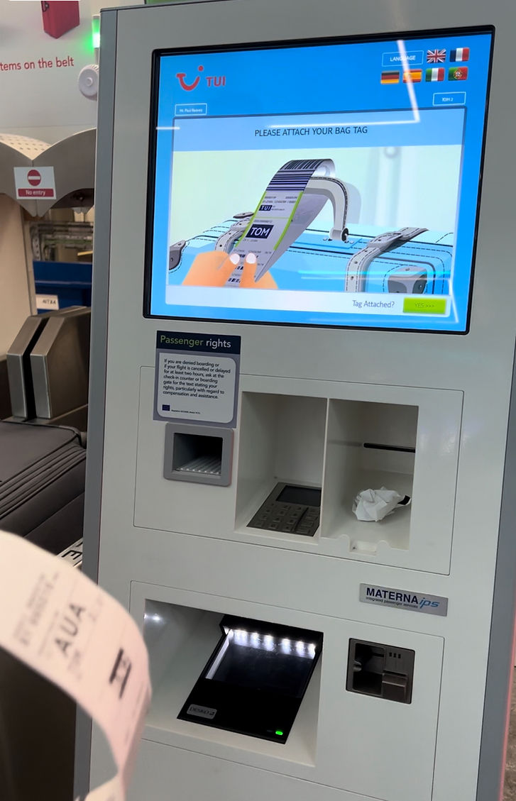 TUI airport check-in kiosk used for baggage drop and luggage allowance checks