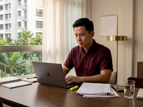 Homeowner reviewing HDB sale paperwork