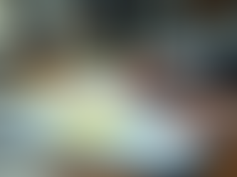 Overdue bills and reminders on a cluttered desk