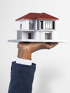 hand-holding-house-real-estate-property-model.jpg
