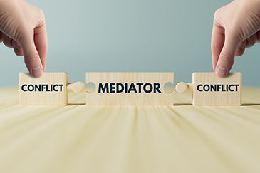 Wooden blocks, puzzles with the word conflict and a mediator that connects them. The conce