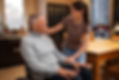 elderly-person-being-taken-care-by-female-caretaker.jpg