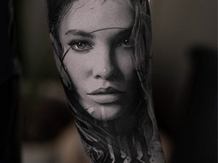 Forearm tatto realism black and grey female portrait