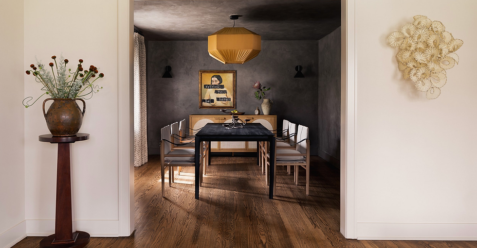 Moody dining room design with dark grey walls and yellow accents