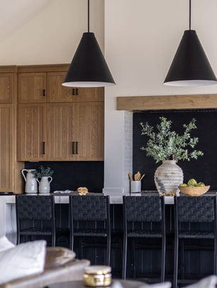 Full service design kitchen with custom cabinetry, natural stone counters, and layered lighting — designed by LINEN + ORCHID.