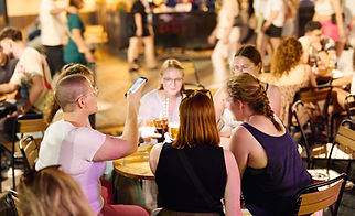 Woman taking pictures of drinks.jpg