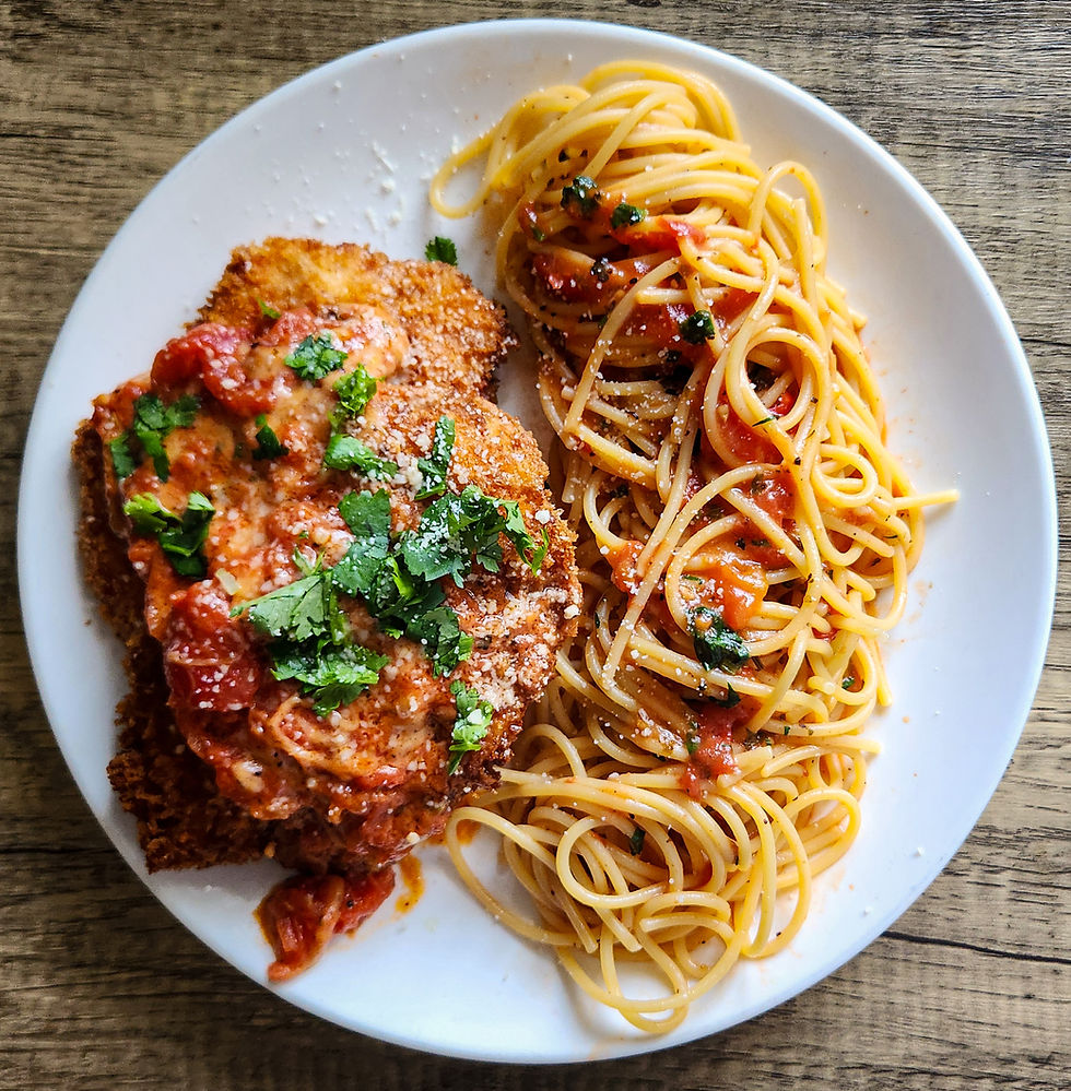 Crispy panko Chicken Parmesan served with spaghetti, tomato sauce, melted mozzarella and grated Parmigiano Reggiano.