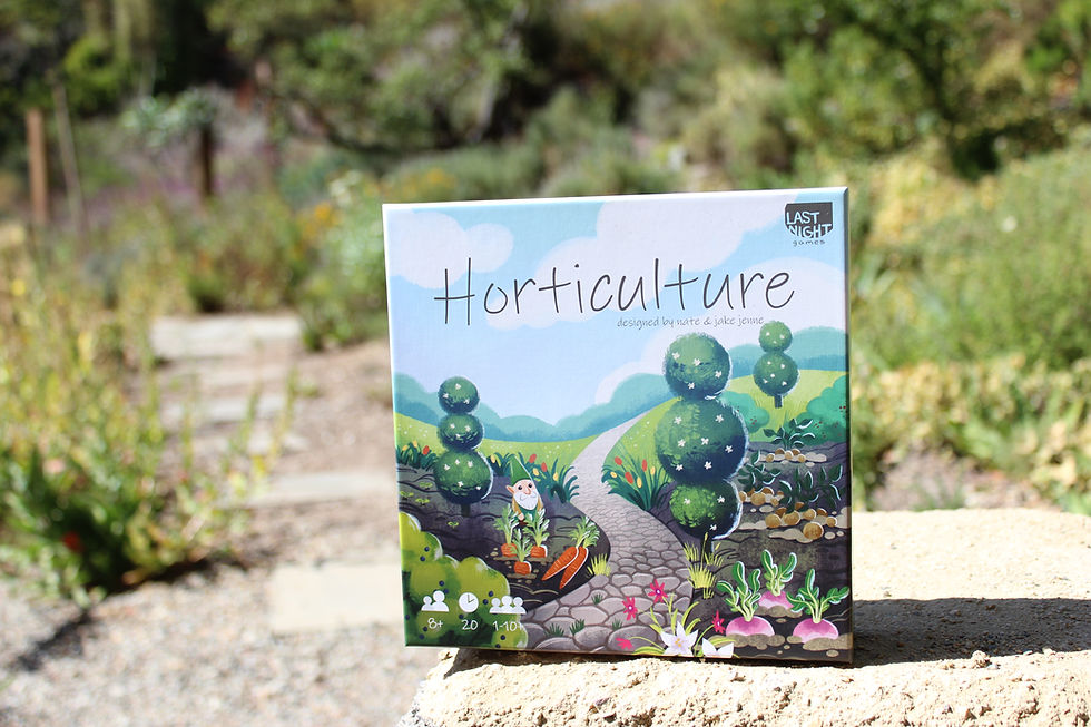 Horticulture game box cover resting on top of a stone bench against a backdrop of a garden with a pathway.