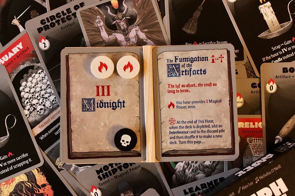 aleph null board game cards book of hours with text and decoration to appear like an old manuscript. White and black tokens on the book.