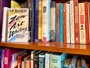 Book shelf of writing and nature books