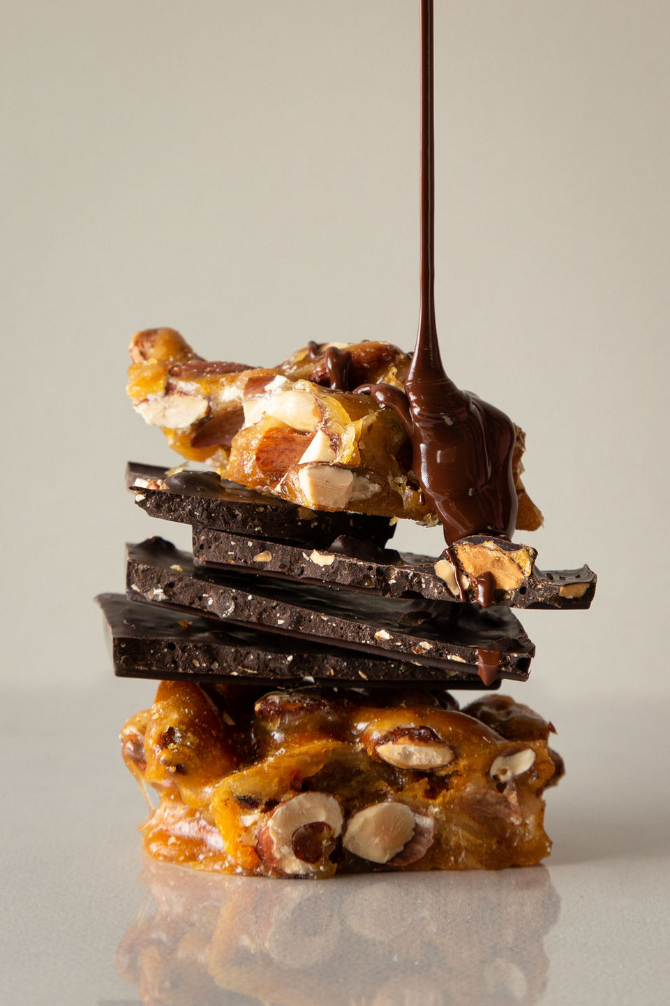Chocolate pouring over caramel