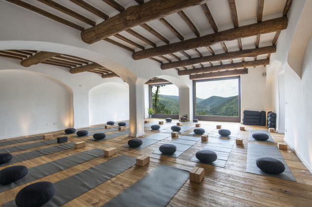 Individual in a quiet moment of guided silence during a therapeutic retreat focused on stress processing and mental clarity