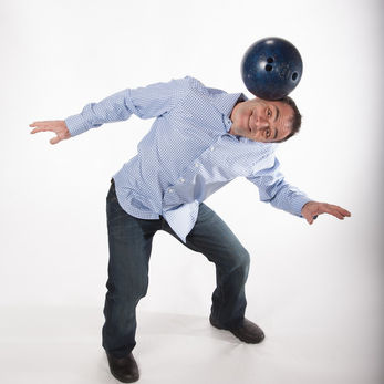 Michael Rosman bowling ball on head corporate