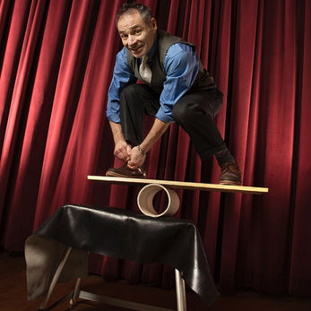 Michael Rosman rolla bolla balancing on board on table