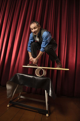 Michael Rosman rolla bolla balancing on board on table