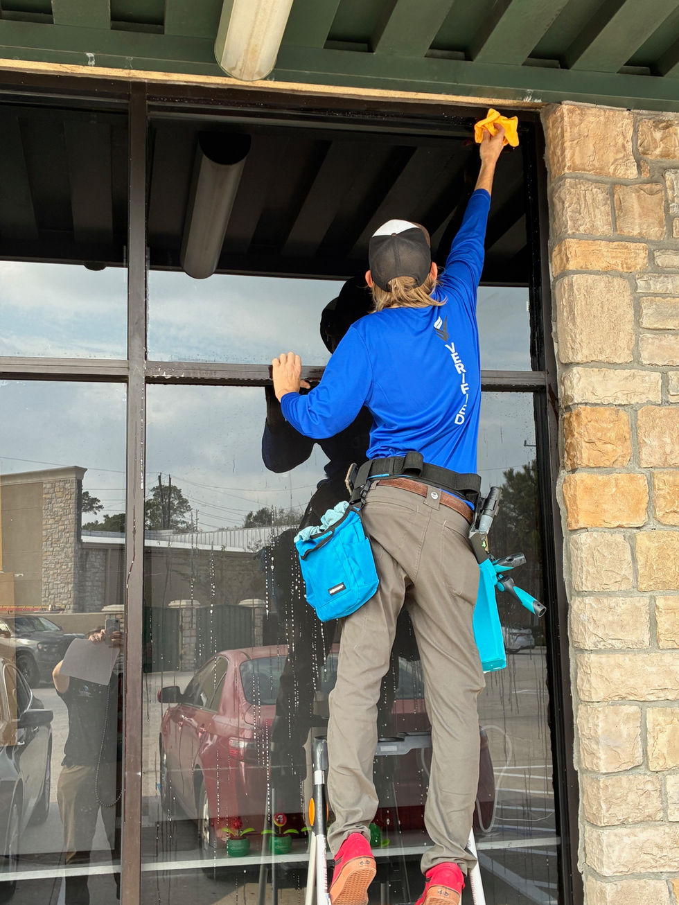 Uniformed technician window clean in humble