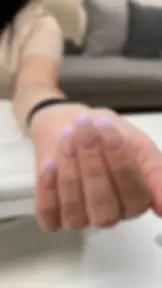 Soft lavender French tip nail extensions on a natural nude base.