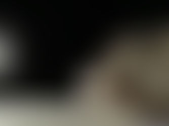 hand writing a signatures on a piece of paper