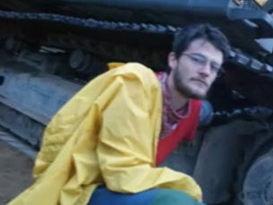 will lawrence chained to a piece of construction equipment 