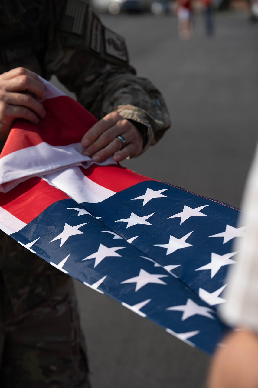 US military member folding an american flag