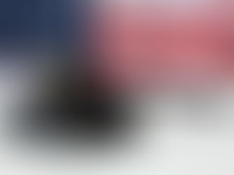 Judges gavel on a white table in front of american flag