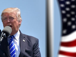 Trump with American flag behind him