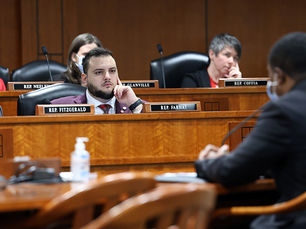 Rep. Farhat sitting in committee meeting.