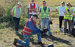 Jim Gregory giving a good demonstration on how to plant trees the right way!