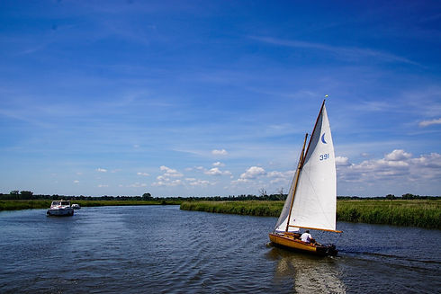 brown and white boat on body of water during daytime_edited.jpg