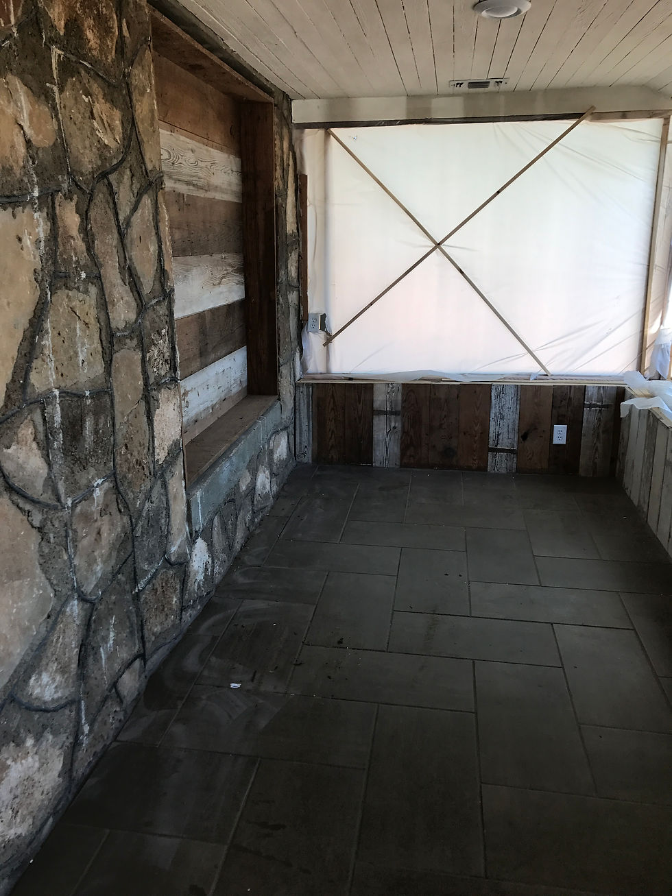 Sunporch with plastic over the windows. 