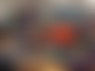 Worker operating a screen printing press for t-shirts