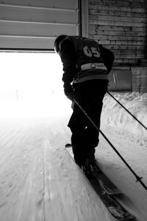 Skier skiing out of lift station.