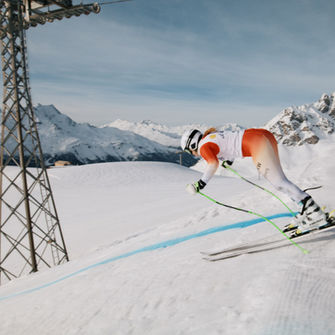 Alpine ski racer pushing off the start gate.
