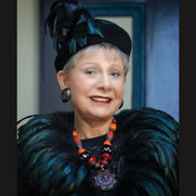 wiman wearing black feathers and Coreen Cordova Jewelry