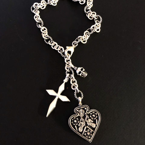 Silver heart pendant by Coreen Cordova