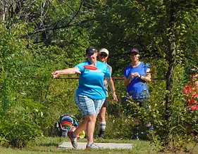 Women Playing Disc Golf.webp