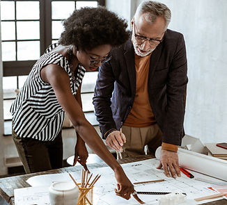 A Man and a Woman looking at a Design_ed